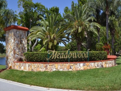 Discover elegance in this beautifully renovated townhome in on Meadowood Golf and Tennis Club in Florida - for sale on GolfHomes.com, golf home, golf lot