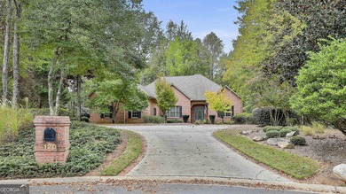 Don't miss this custom built all brick home with a 4 car garage on Whitewater Creek in Georgia - for sale on GolfHomes.com, golf home, golf lot
