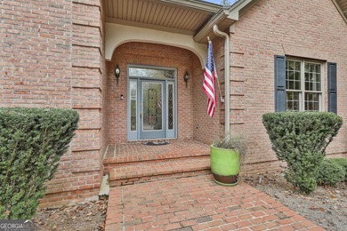 Don't miss this custom built all brick home with a 4 car garage on Whitewater Creek in Georgia - for sale on GolfHomes.com, golf home, golf lot