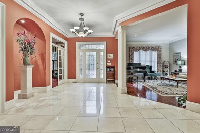 Don't miss this custom built all brick home with a 4 car garage on Whitewater Creek in Georgia - for sale on GolfHomes.com, golf home, golf lot