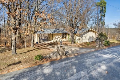 Well-maintained and thoughtfully updated, this three-bedroom on Bella Vista Country Club - Berksdale in Arkansas - for sale on GolfHomes.com, golf home, golf lot