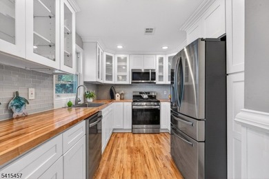 Perched high above Lake Mohawk on coveted Birch Parkway, this on Lake Mohawk Golf Club in New Jersey - for sale on GolfHomes.com, golf home, golf lot