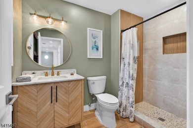 Perched high above Lake Mohawk on coveted Birch Parkway, this on Lake Mohawk Golf Club in New Jersey - for sale on GolfHomes.com, golf home, golf lot