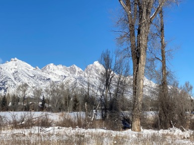 Enjoy beautiful Grand Teton views from this premier .84 acre lot on Jackson Hole Golf and Tennis Club in Wyoming - for sale on GolfHomes.com, golf home, golf lot