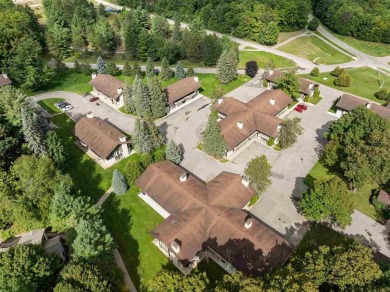 Experience the ultimate mountain retreat at this impeccably on Boyne Mountain Resort - Alpine in Michigan - for sale on GolfHomes.com, golf home, golf lot