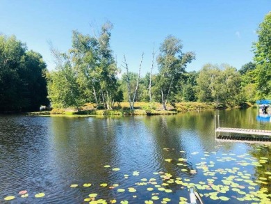 This waterfront lot has 100 ft. on ''Finger Lake'', which is the on St. Ives Golf Club in Michigan - for sale on GolfHomes.com, golf home, golf lot