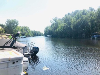 This waterfront lot has 100 ft. on ''Finger Lake'', which is the on St. Ives Golf Club in Michigan - for sale on GolfHomes.com, golf home, golf lot