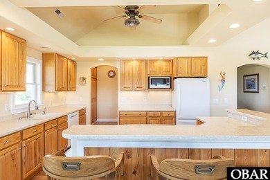 Coastal elegance meets timeless craftsmanship in Kitty Hawk, NC! on Seascape Golf Links in North Carolina - for sale on GolfHomes.com, golf home, golf lot