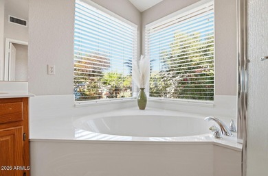 A Botanical Masterpiece Backing to Estrella's Twin Lakes. Set on on Estrella Mountain Ranch Golf Course in Arizona - for sale on GolfHomes.com, golf home, golf lot