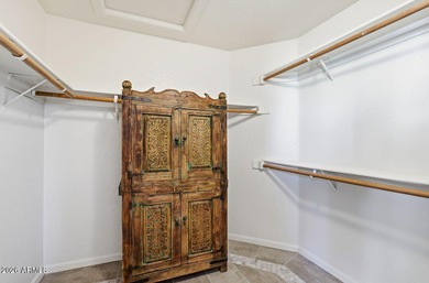 A Botanical Masterpiece Backing to Estrella's Twin Lakes. Set on on Estrella Mountain Ranch Golf Course in Arizona - for sale on GolfHomes.com, golf home, golf lot