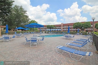 2-BEDROOM, 2-BATHROOM CONDOMINIUM IN SUNRISE LAKES OFFERS AN on Sunrise Lakes Phase III in Florida - for sale on GolfHomes.com, golf home, golf lot