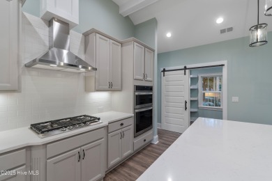 This brand new Riptide home with stunning setting and finishes on Sea Trail Golf Resort in North Carolina - for sale on GolfHomes.com, golf home, golf lot