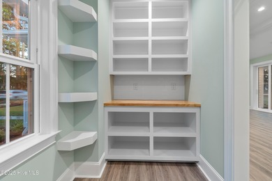 This brand new Riptide home with stunning setting and finishes on Sea Trail Golf Resort in North Carolina - for sale on GolfHomes.com, golf home, golf lot