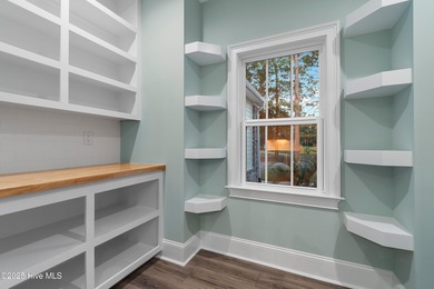 This brand new Riptide home with stunning setting and finishes on Sea Trail Golf Resort in North Carolina - for sale on GolfHomes.com, golf home, golf lot