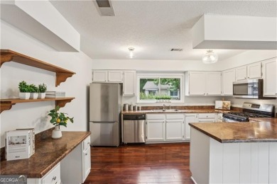 Welcome to this spacious and versatile end-unit townhome in the on Indian Hills Country Club in Georgia - for sale on GolfHomes.com, golf home, golf lot
