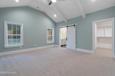 This brand new Riptide home with stunning setting and finishes on Sea Trail Golf Resort in North Carolina - for sale on GolfHomes.com, golf home, golf lot