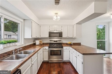 Welcome to this spacious and versatile end-unit townhome in the on Indian Hills Country Club in Georgia - for sale on GolfHomes.com, golf home, golf lot