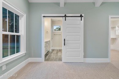 This brand new Riptide home with stunning setting and finishes on Sea Trail Golf Resort in North Carolina - for sale on GolfHomes.com, golf home, golf lot