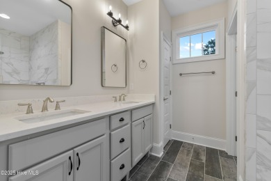 This brand new Riptide home with stunning setting and finishes on Sea Trail Golf Resort in North Carolina - for sale on GolfHomes.com, golf home, golf lot