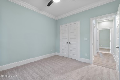 This brand new Riptide home with stunning setting and finishes on Sea Trail Golf Resort in North Carolina - for sale on GolfHomes.com, golf home, golf lot