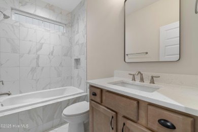 This brand new Riptide home with stunning setting and finishes on Sea Trail Golf Resort in North Carolina - for sale on GolfHomes.com, golf home, golf lot