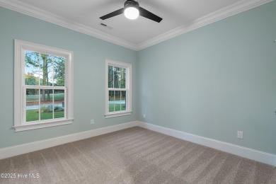 This brand new Riptide home with stunning setting and finishes on Sea Trail Golf Resort in North Carolina - for sale on GolfHomes.com, golf home, golf lot