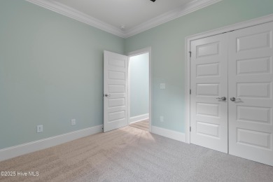 This brand new Riptide home with stunning setting and finishes on Sea Trail Golf Resort in North Carolina - for sale on GolfHomes.com, golf home, golf lot