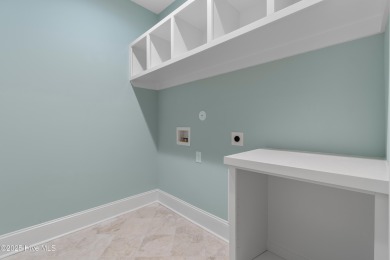 This brand new Riptide home with stunning setting and finishes on Sea Trail Golf Resort in North Carolina - for sale on GolfHomes.com, golf home, golf lot