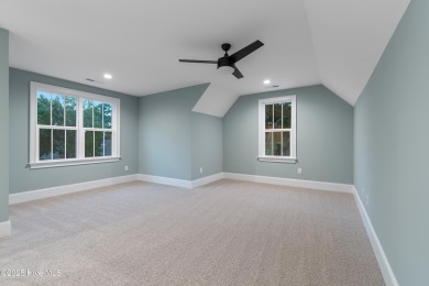 This brand new Riptide home with stunning setting and finishes on Sea Trail Golf Resort in North Carolina - for sale on GolfHomes.com, golf home, golf lot