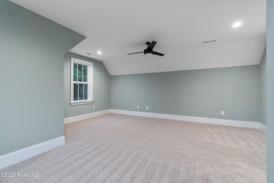This brand new Riptide home with stunning setting and finishes on Sea Trail Golf Resort in North Carolina - for sale on GolfHomes.com, golf home, golf lot