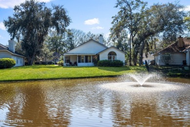 Welcome to your dream retreat! Stunning views of a pond and on Blue Cypress Golf Club in Florida - for sale on GolfHomes.com, golf home, golf lot