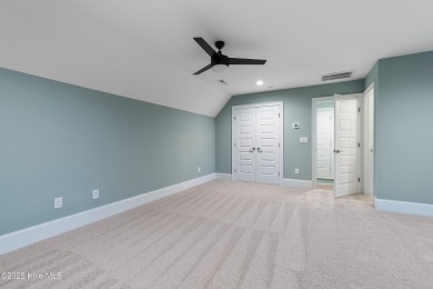 This brand new Riptide home with stunning setting and finishes on Sea Trail Golf Resort in North Carolina - for sale on GolfHomes.com, golf home, golf lot
