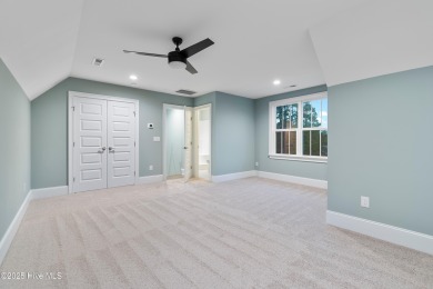 This brand new Riptide home with stunning setting and finishes on Sea Trail Golf Resort in North Carolina - for sale on GolfHomes.com, golf home, golf lot