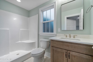 This brand new Riptide home with stunning setting and finishes on Sea Trail Golf Resort in North Carolina - for sale on GolfHomes.com, golf home, golf lot