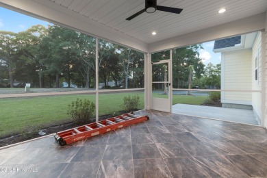 This brand new Riptide home with stunning setting and finishes on Sea Trail Golf Resort in North Carolina - for sale on GolfHomes.com, golf home, golf lot