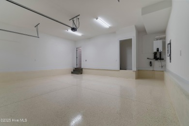 This brand new Riptide home with stunning setting and finishes on Sea Trail Golf Resort in North Carolina - for sale on GolfHomes.com, golf home, golf lot