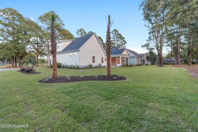 This brand new Riptide home with stunning setting and finishes on Sea Trail Golf Resort in North Carolina - for sale on GolfHomes.com, golf home, golf lot