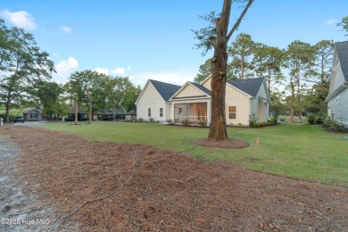 This brand new Riptide home with stunning setting and finishes on Sea Trail Golf Resort in North Carolina - for sale on GolfHomes.com, golf home, golf lot