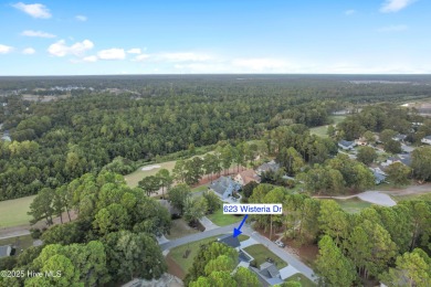 This brand new Riptide home with stunning setting and finishes on Sea Trail Golf Resort in North Carolina - for sale on GolfHomes.com, golf home, golf lot