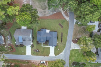 This brand new Riptide home with stunning setting and finishes on Sea Trail Golf Resort in North Carolina - for sale on GolfHomes.com, golf home, golf lot