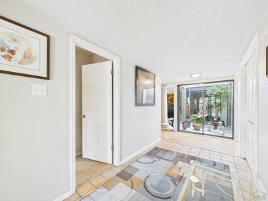 Spacious 2,028 sq ft Spanish Mediterranean-style townhome on Desert Hawk At Pueblo West in Colorado - for sale on GolfHomes.com, golf home, golf lot