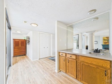 Spacious 2,028 sq ft Spanish Mediterranean-style townhome on Desert Hawk At Pueblo West in Colorado - for sale on GolfHomes.com, golf home, golf lot
