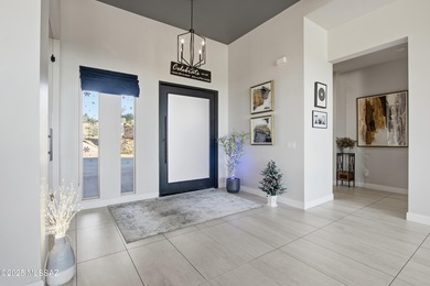 This exceptional, former Fairfield model home blends elevated on Omni Tucson National Golf Resort and Spa - Catalina in Arizona - for sale on GolfHomes.com, golf home, golf lot