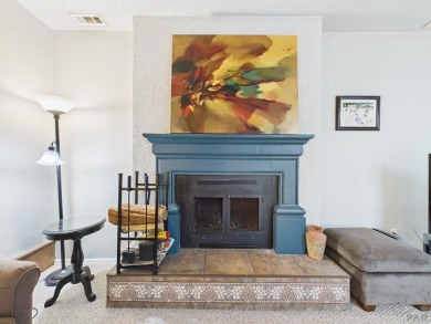 Spacious 2,028 sq ft Spanish Mediterranean-style townhome on Desert Hawk At Pueblo West in Colorado - for sale on GolfHomes.com, golf home, golf lot