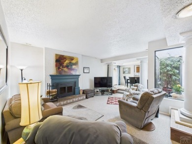 Spacious 2,028 sq ft Spanish Mediterranean-style townhome on Desert Hawk At Pueblo West in Colorado - for sale on GolfHomes.com, golf home, golf lot