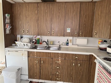 YOU CAN CHANGE THE INSIDE BUT CAN'T CHANGE THE OUTSIDE. Original on Wynmoor Golf Course in Florida - for sale on GolfHomes.com, golf home, golf lot