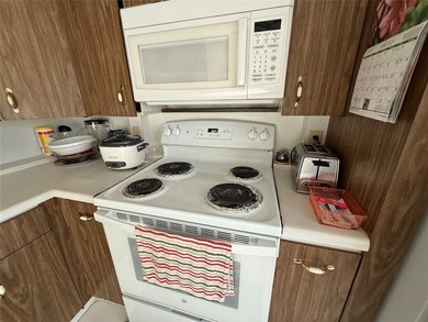 YOU CAN CHANGE THE INSIDE BUT CAN'T CHANGE THE OUTSIDE. Original on Wynmoor Golf Course in Florida - for sale on GolfHomes.com, golf home, golf lot