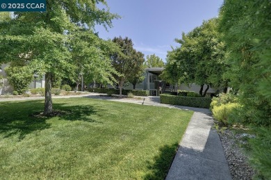 Lovely light filled Sonoma model with scenic outlook from your on Rossmoor Golf Course in California - for sale on GolfHomes.com, golf home, golf lot