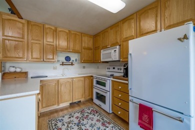Welcome to this bright  inviting 4-bedroom, 3-bathroom home on Olive Glenn Golf and Country Club in Wyoming - for sale on GolfHomes.com, golf home, golf lot