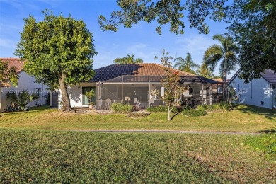 This gorgeous meticulously maintained split-bedroom home is on Woodmont Country Club in Florida - for sale on GolfHomes.com, golf home, golf lot